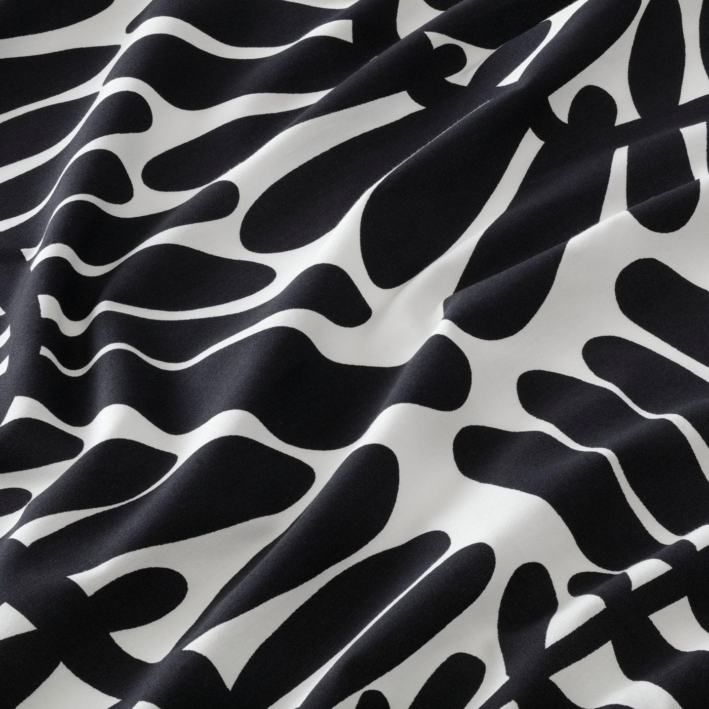 Close up of MAJSMOTT bed linen in a black and white botanical print.