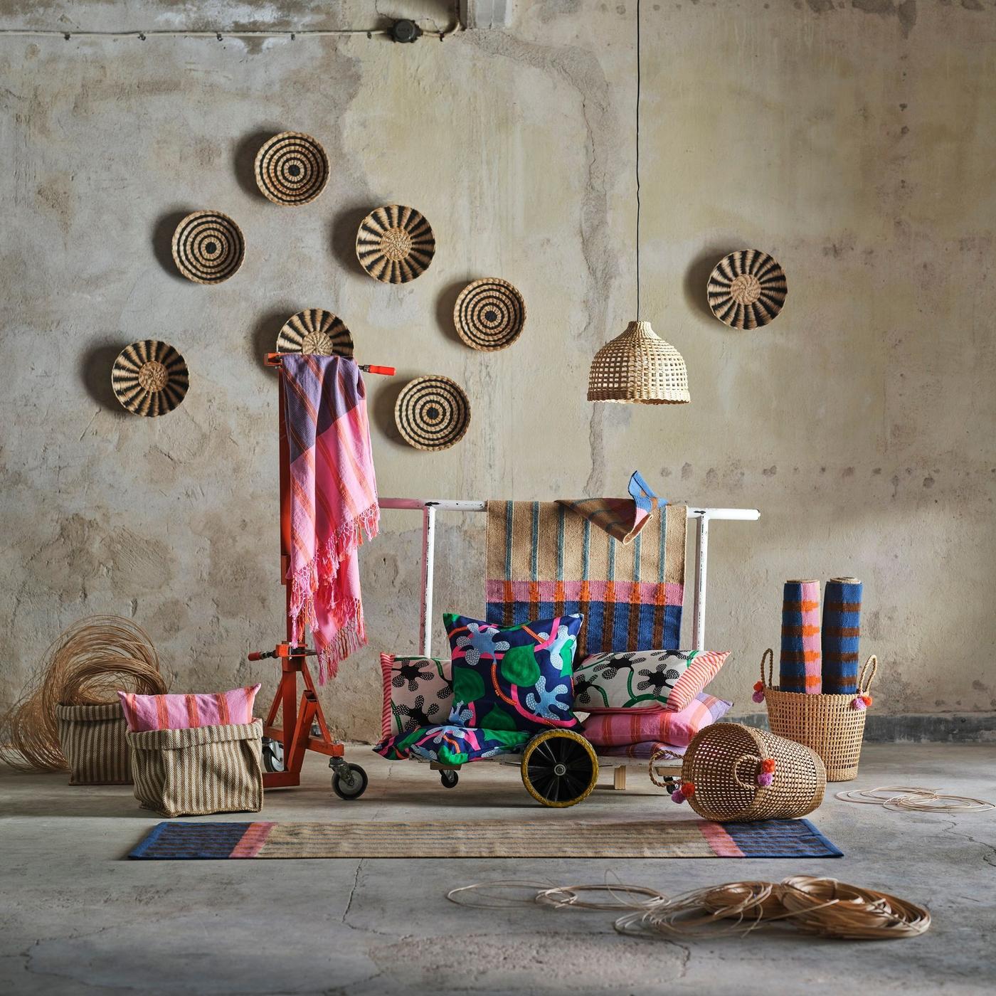 Colorful handmade products displayed in a concrete space.