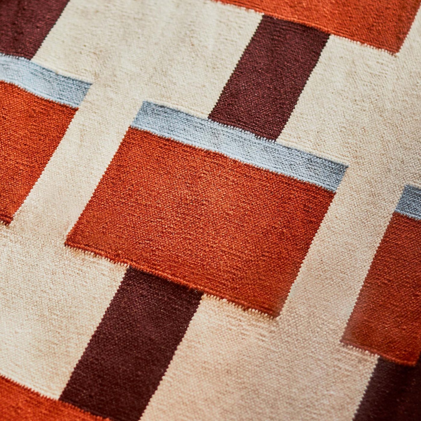 Brown, burnt orange and cream graphical pattern.