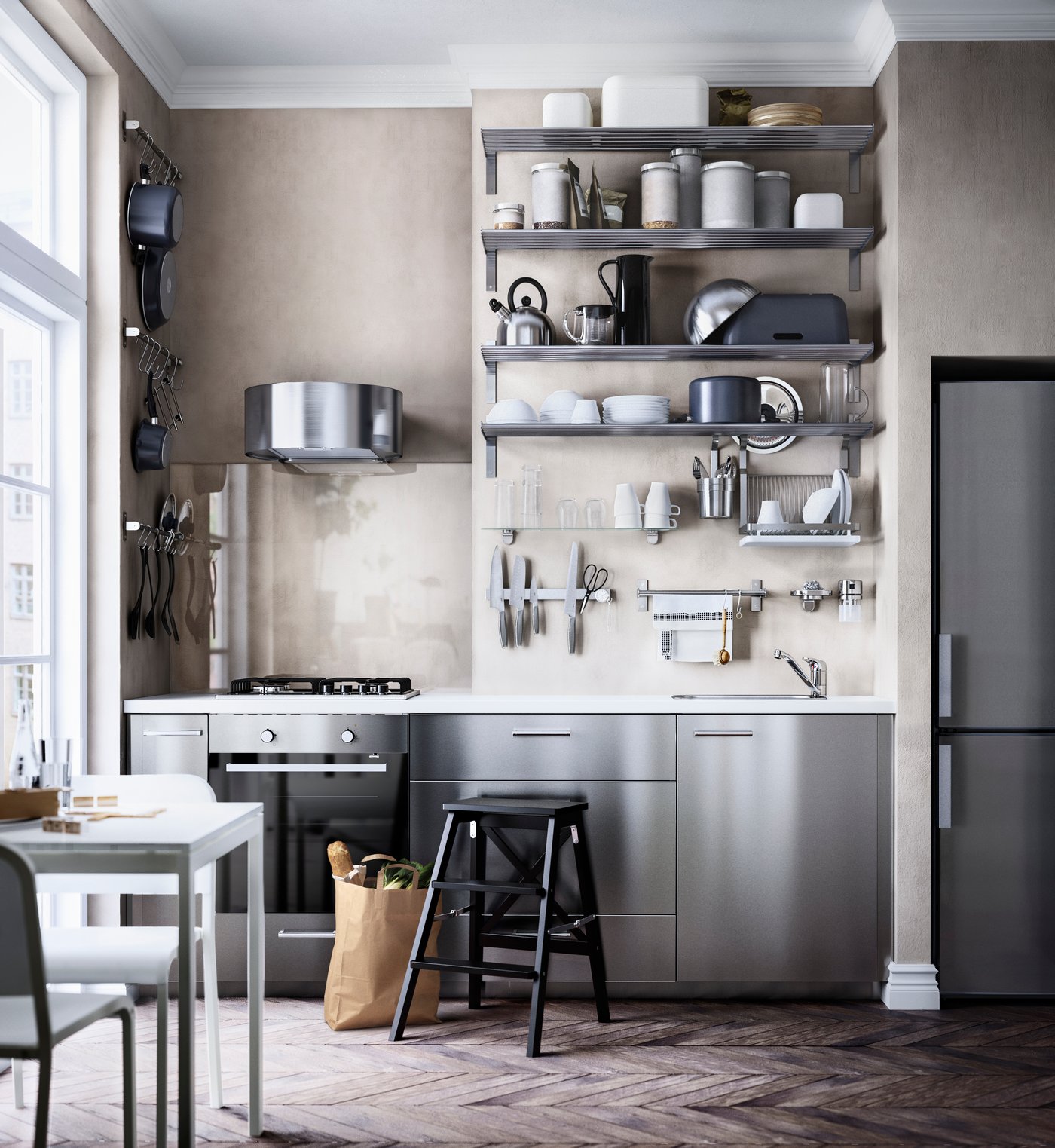 A neutral beige-grey coloured kitchen with metal kitchen fronts and ope shelving.
