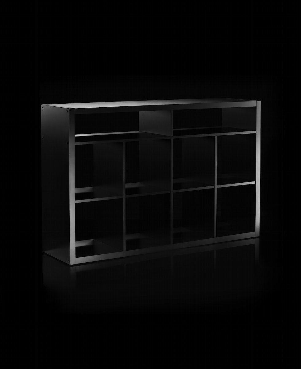 Black OBEGRÄNSAD shelving unit on a black background.
