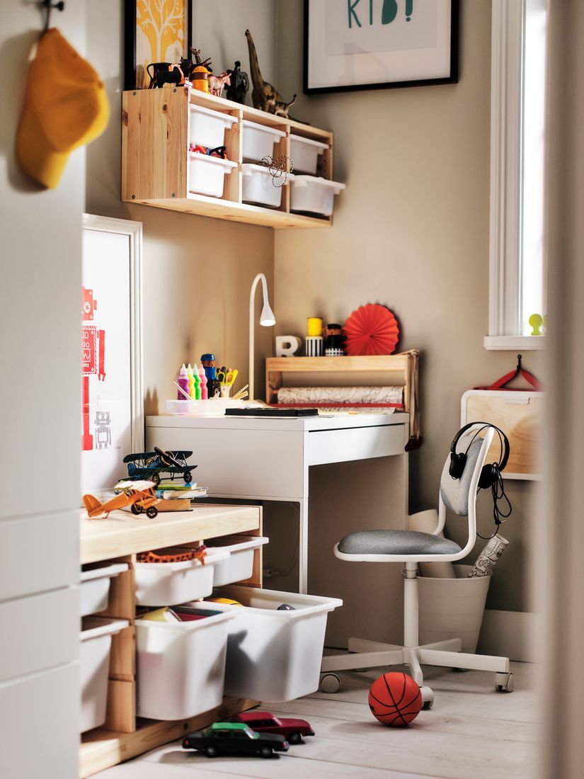 Bright, sunny corner of a children's room with a desk and TROFAST storage units.