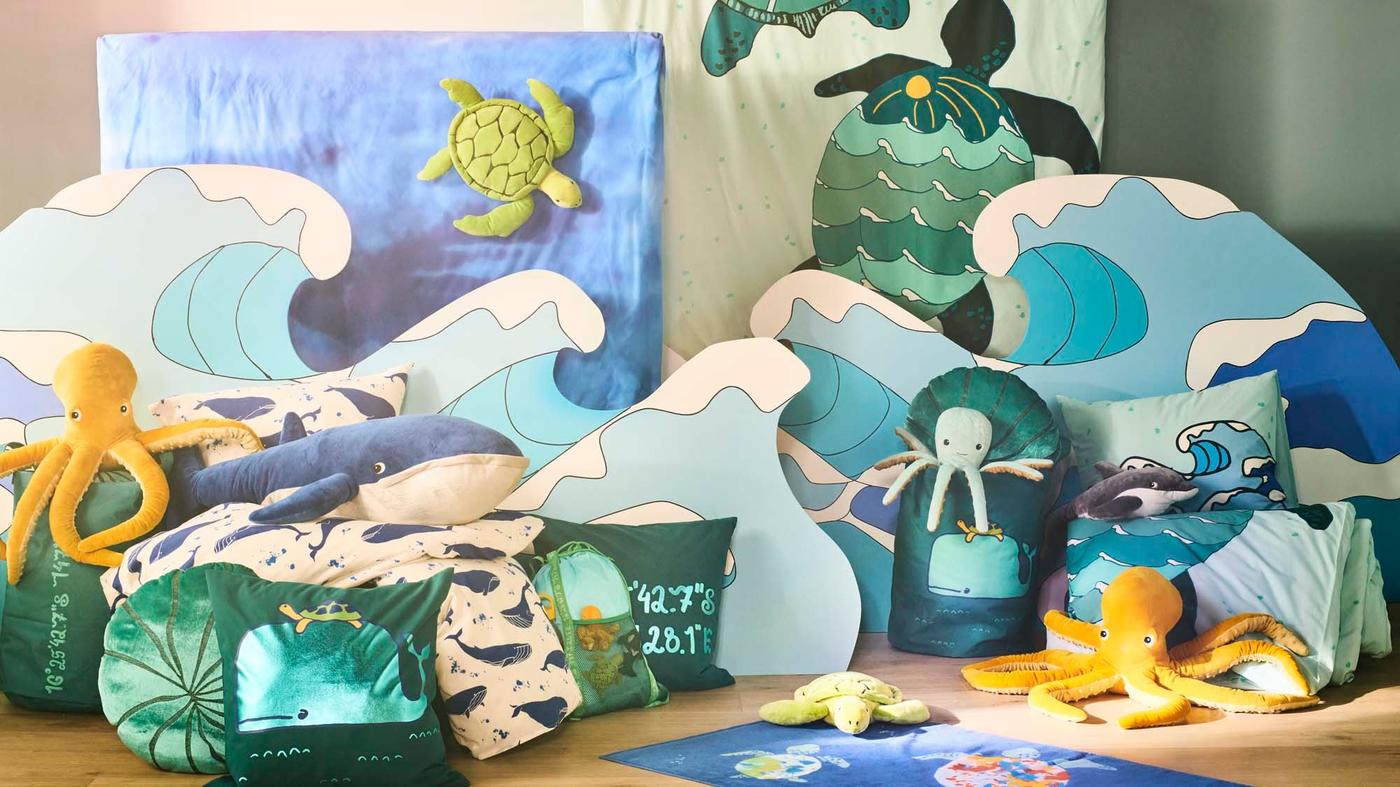 A collection of marine inspired toys and home furnishing items all displayed together.