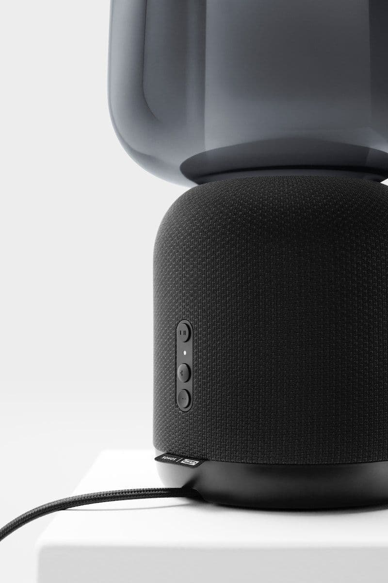 Close up of the cable, control buttons and speaker base of the SYMFONISK speaker lamp.