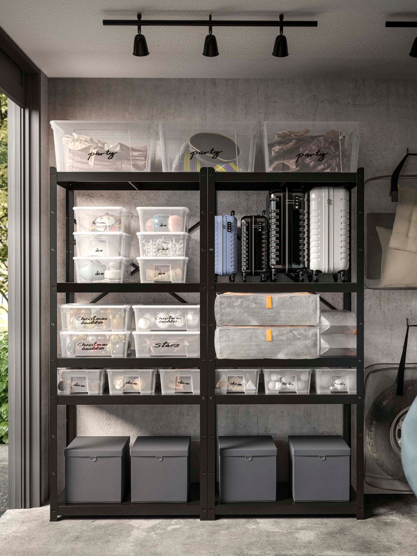 Black BROR shelves stand in an open garage. The shelves are stacked with storage boxes in clear and grey.