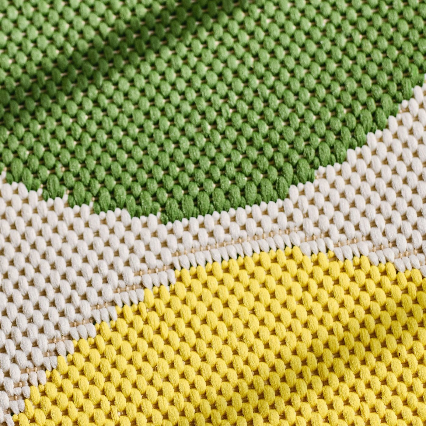 A close-up of a BRÖGGAN rug flatwoven.