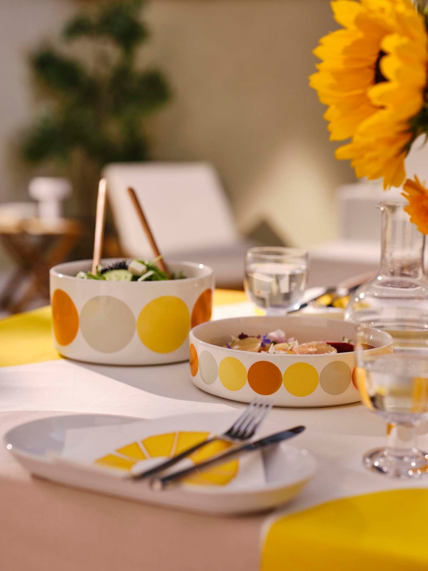 BRÖGGAN bowls filled with food on a table dressed in a BRÖGGAN tablecloth.