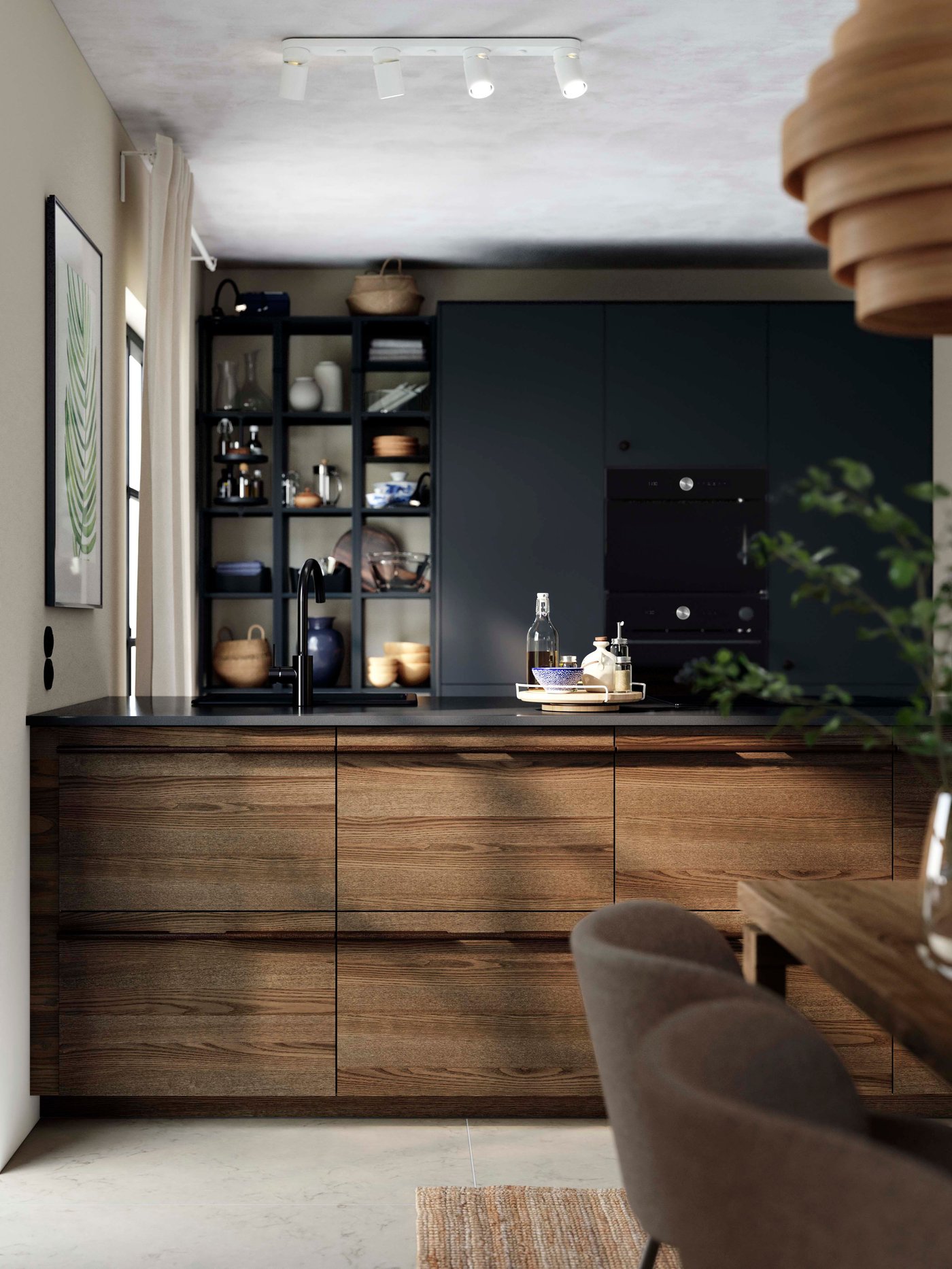 White spot lights in a black and dark wood kitchen.