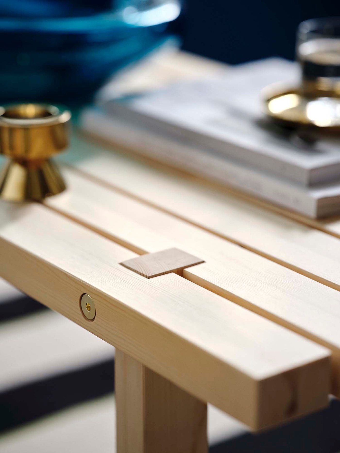 A close-up of the corner of the STOCKHOLM bench/shelving unit.
