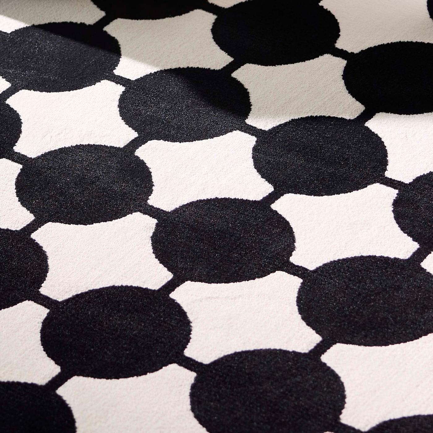 A close-up of a graphic patterned rug.