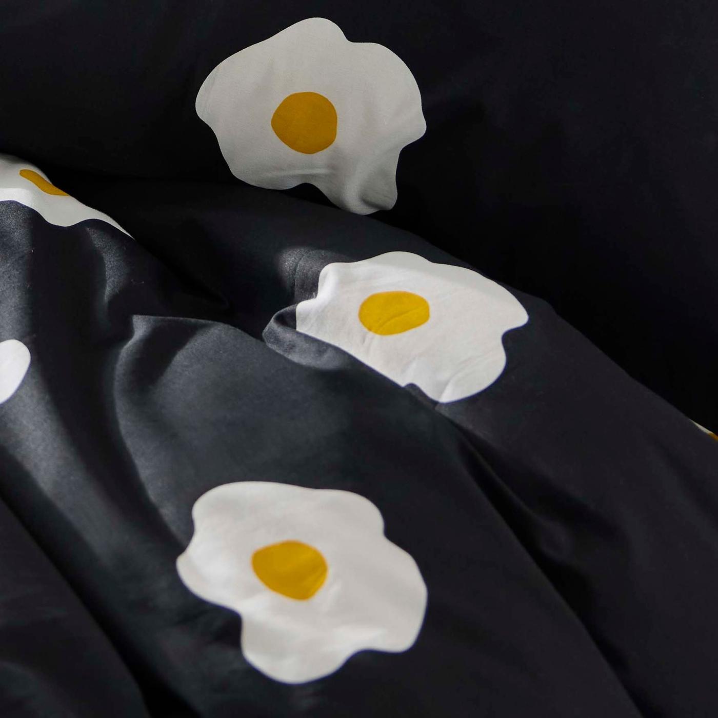 Close-up of the black patterned duvet cover.