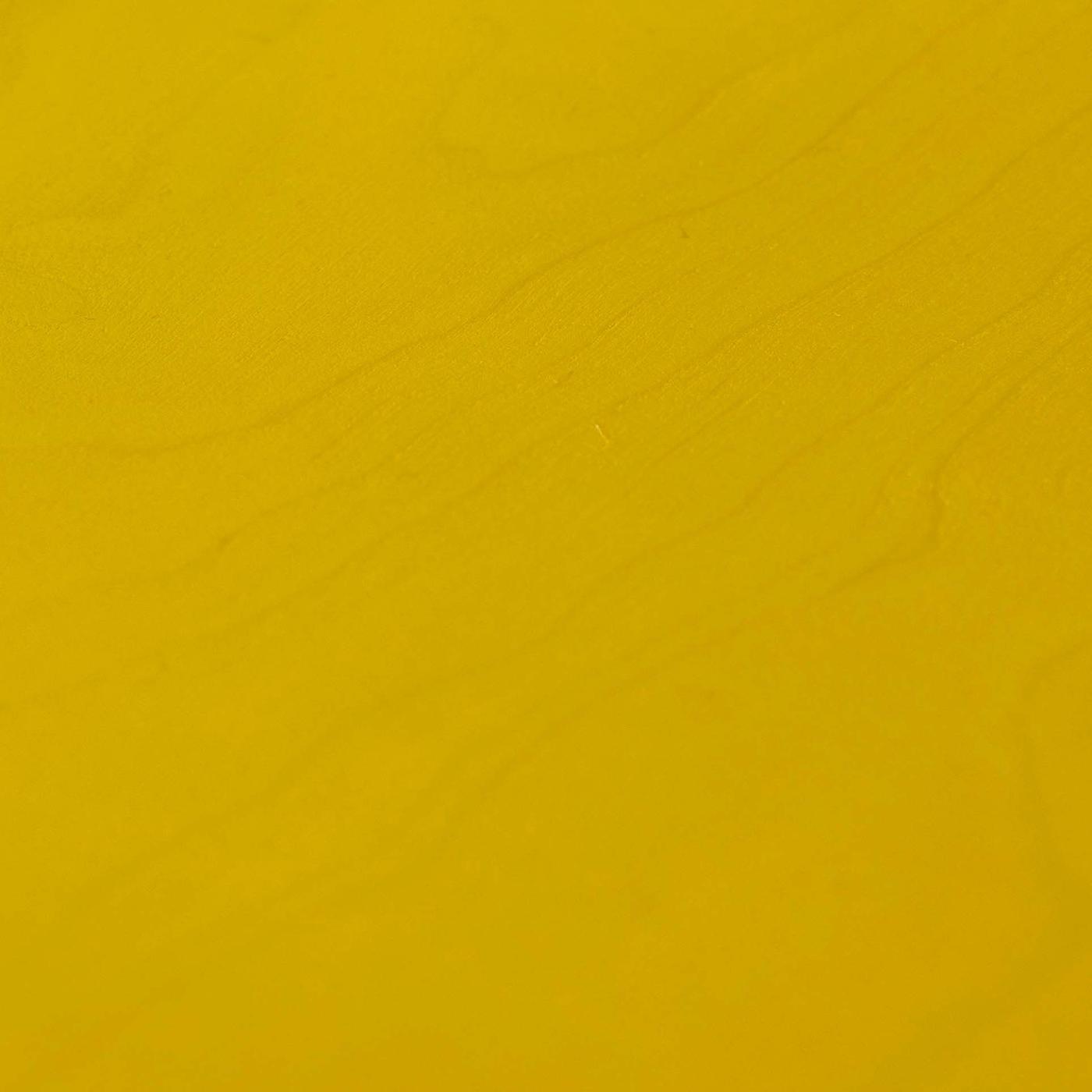 A close-up of yellow lacquered wood.
