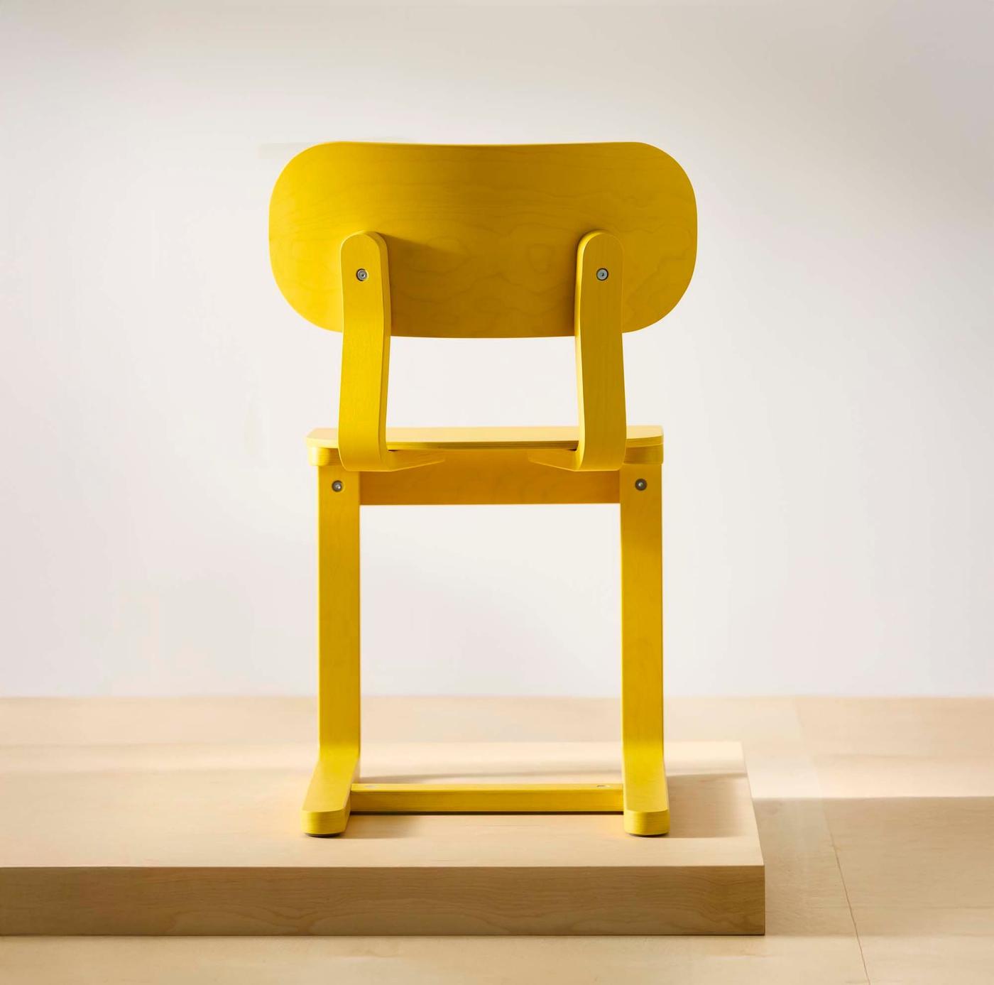 A back view of a yellow LYCKAN chair.
