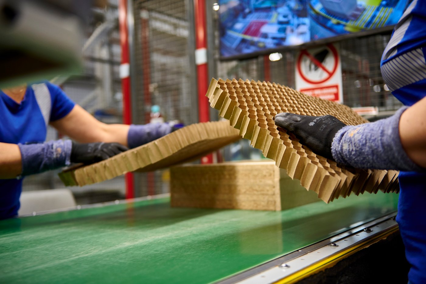 A close-up of hands inspecting material onsite in Lubawa.