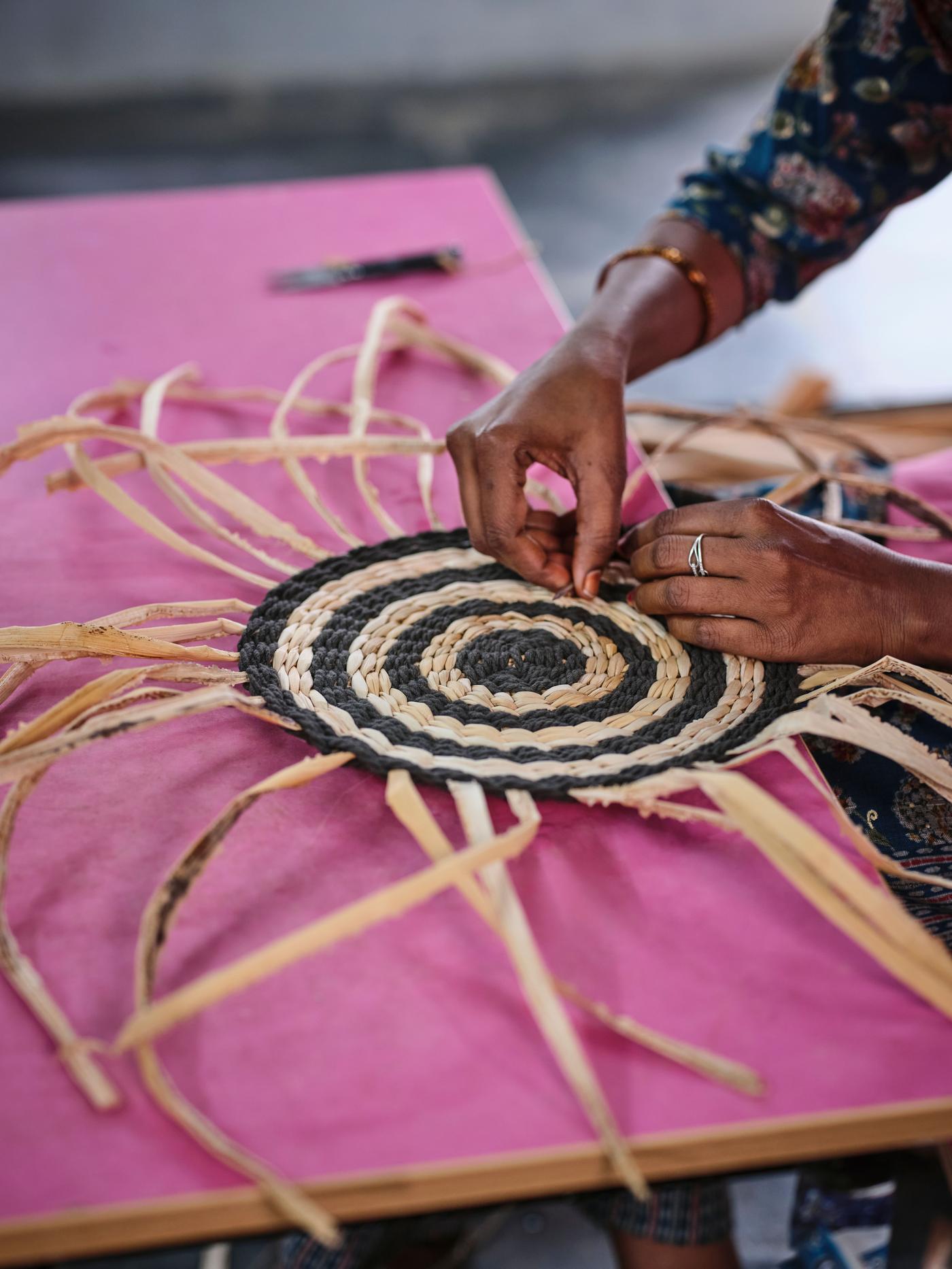 A close up of the handcrafting process for the wall decoration. 