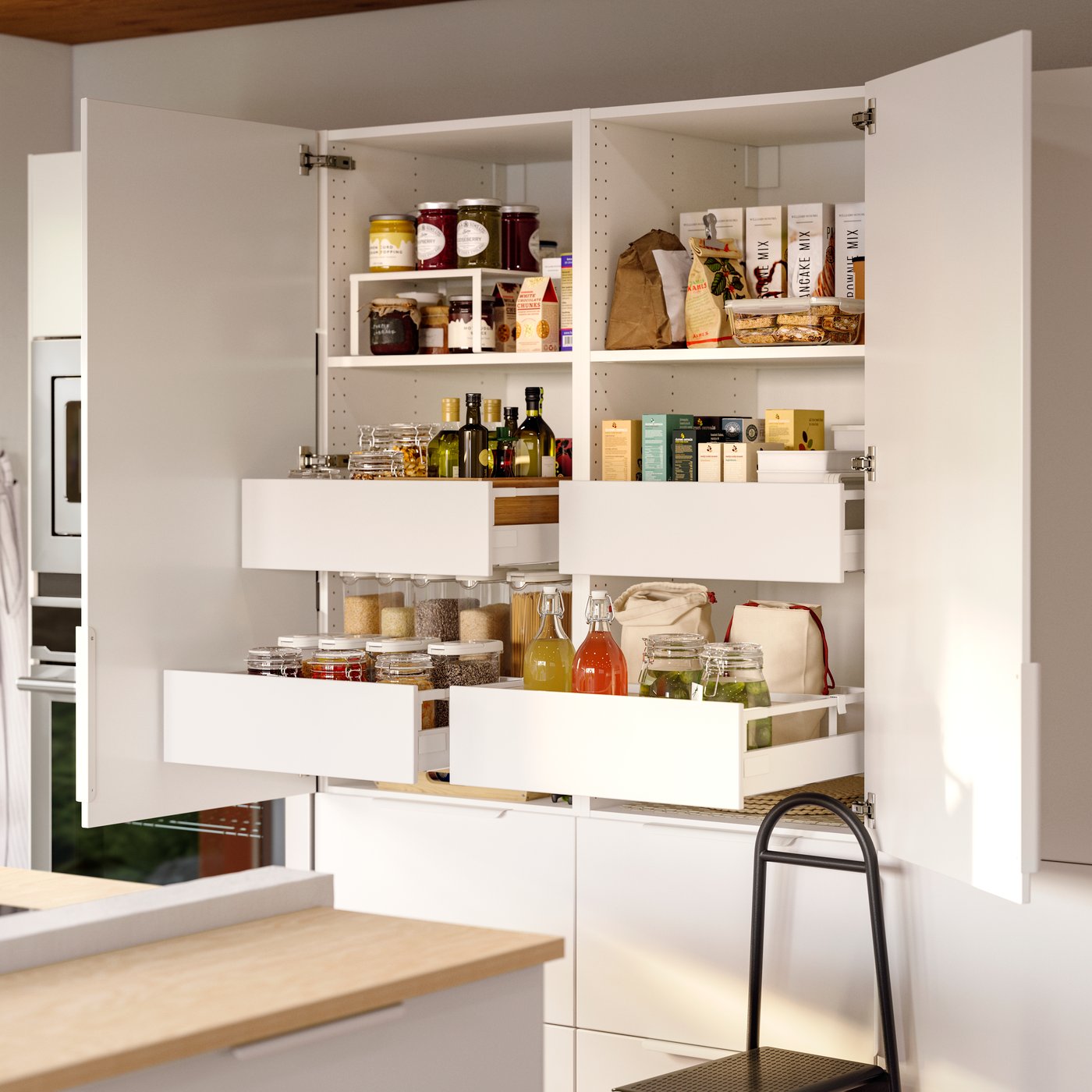 A open, full-height, double-doored pantry with white doors and drawers, revealing an assortment of neatly organised foods.