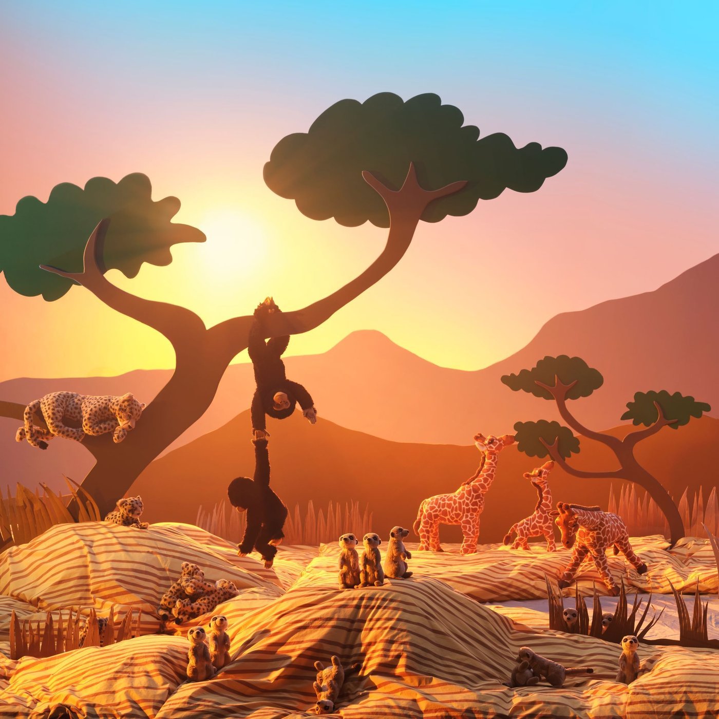 Several different soft toys of which monkeys, giraffes and meercats, all displayed with a backdrop inspired by the African Savannah.