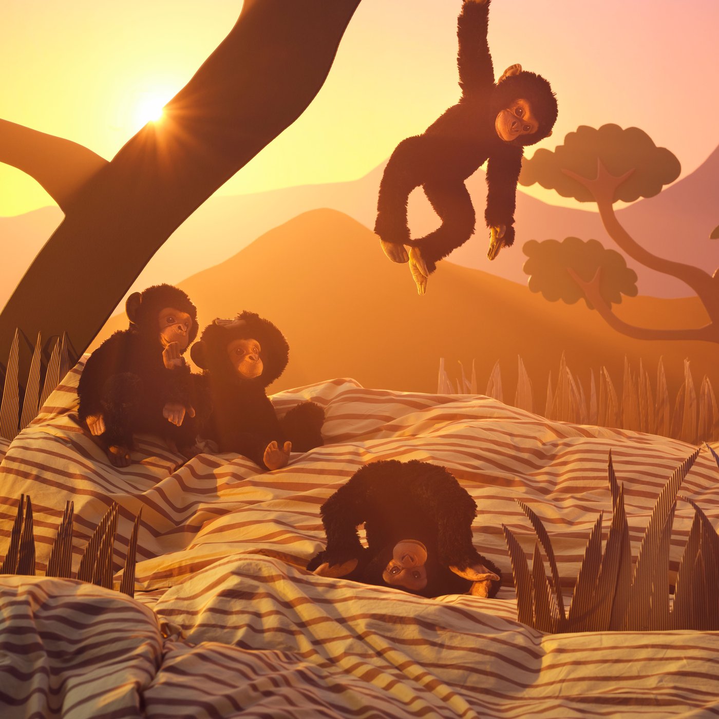Four soft toy chimpanzees playing by a tree in an imaginary African savannah setting.