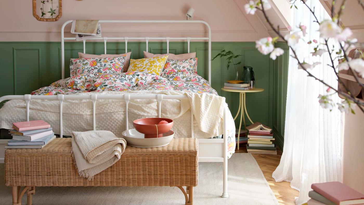 A pink, green and neutral bedroom with floral touches.