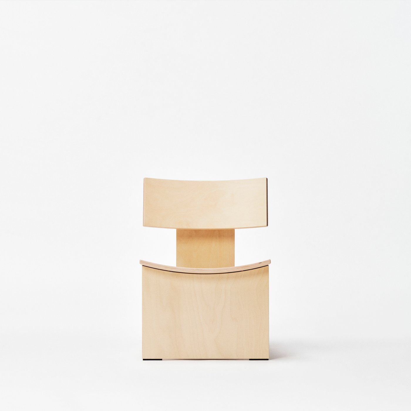A plywood chair silhouette is standing against a while neutral background.