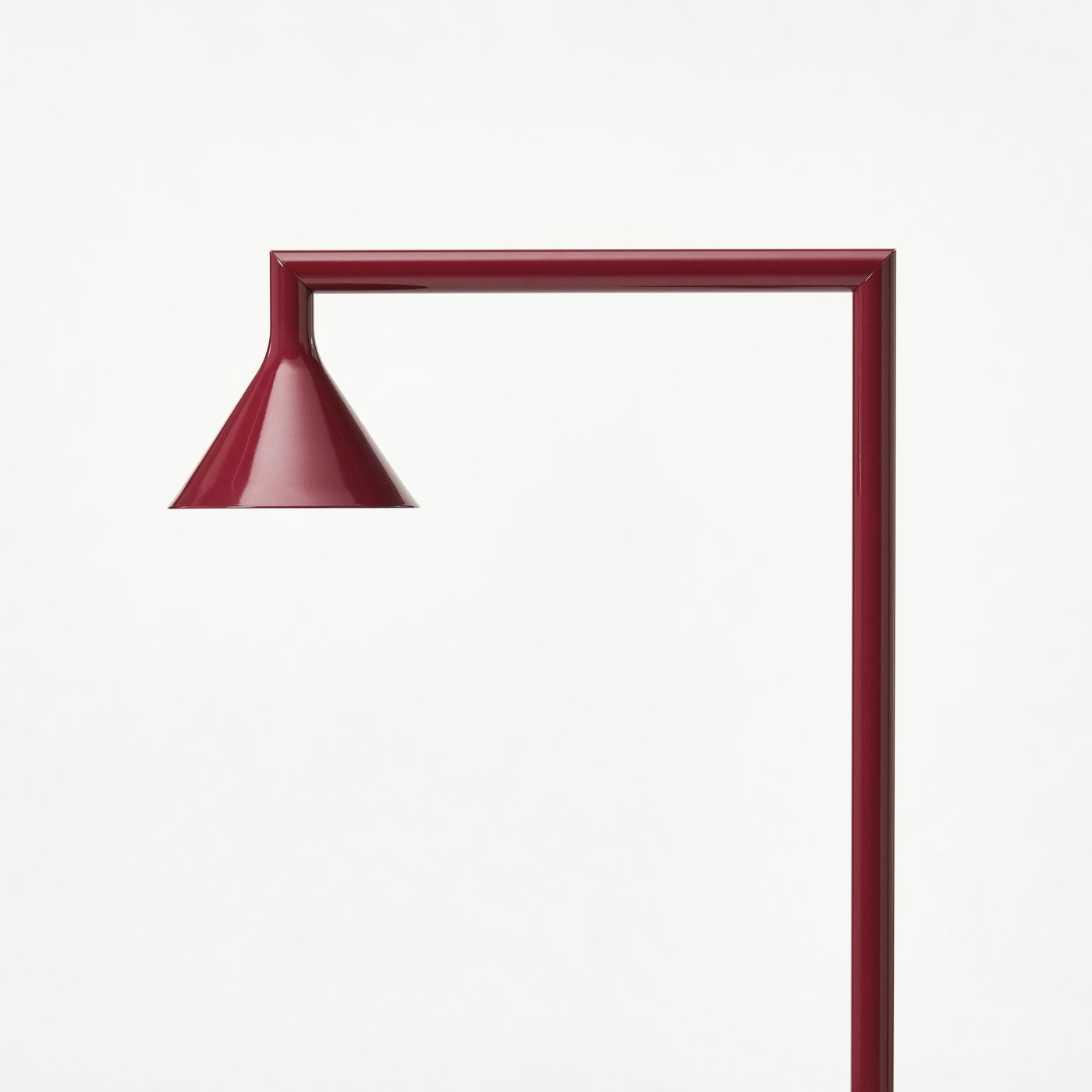 Three floor lamps in pale yellow, burgundy, and blue standing upright in a row against a white background.