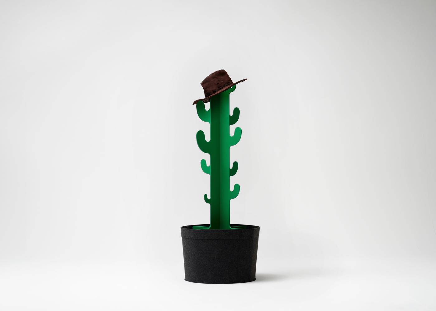 A decorative cactus-shaped clothes hanger in green with a black base against a white background.