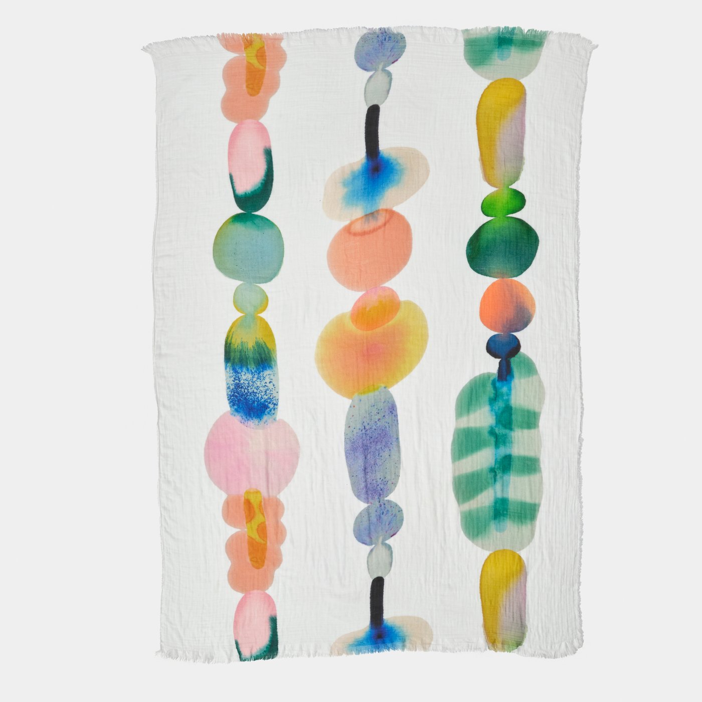 A piece of colourful fabric against a white backdrop.