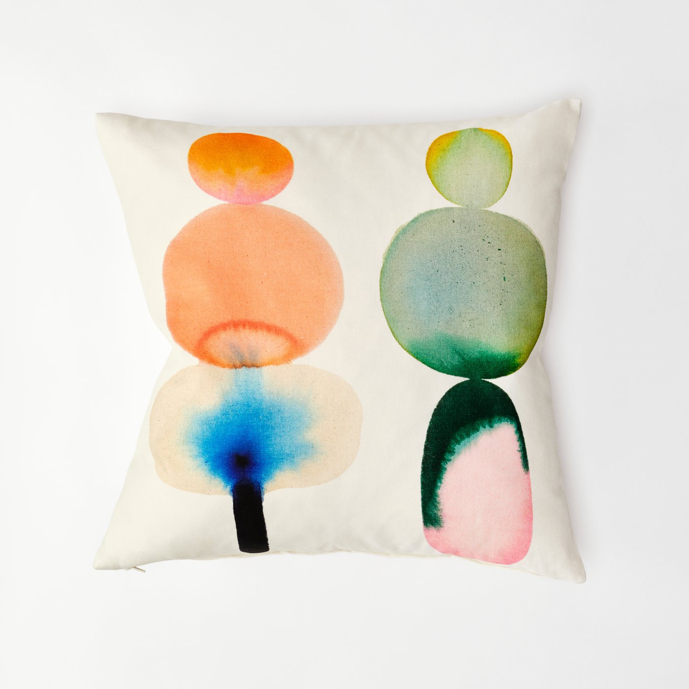 A colourful patterned cushion against a white background.
