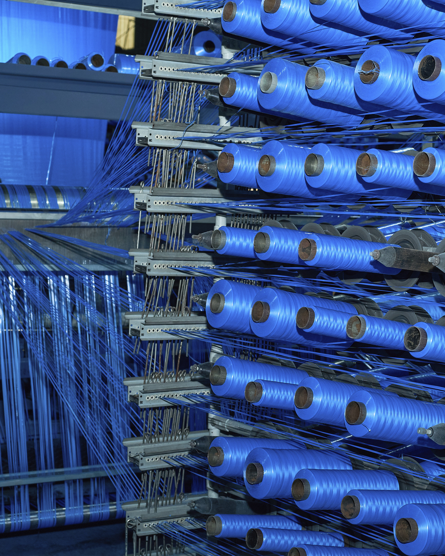 Spools of thread are stacked and ready to be weaved into FRAKTA bags.