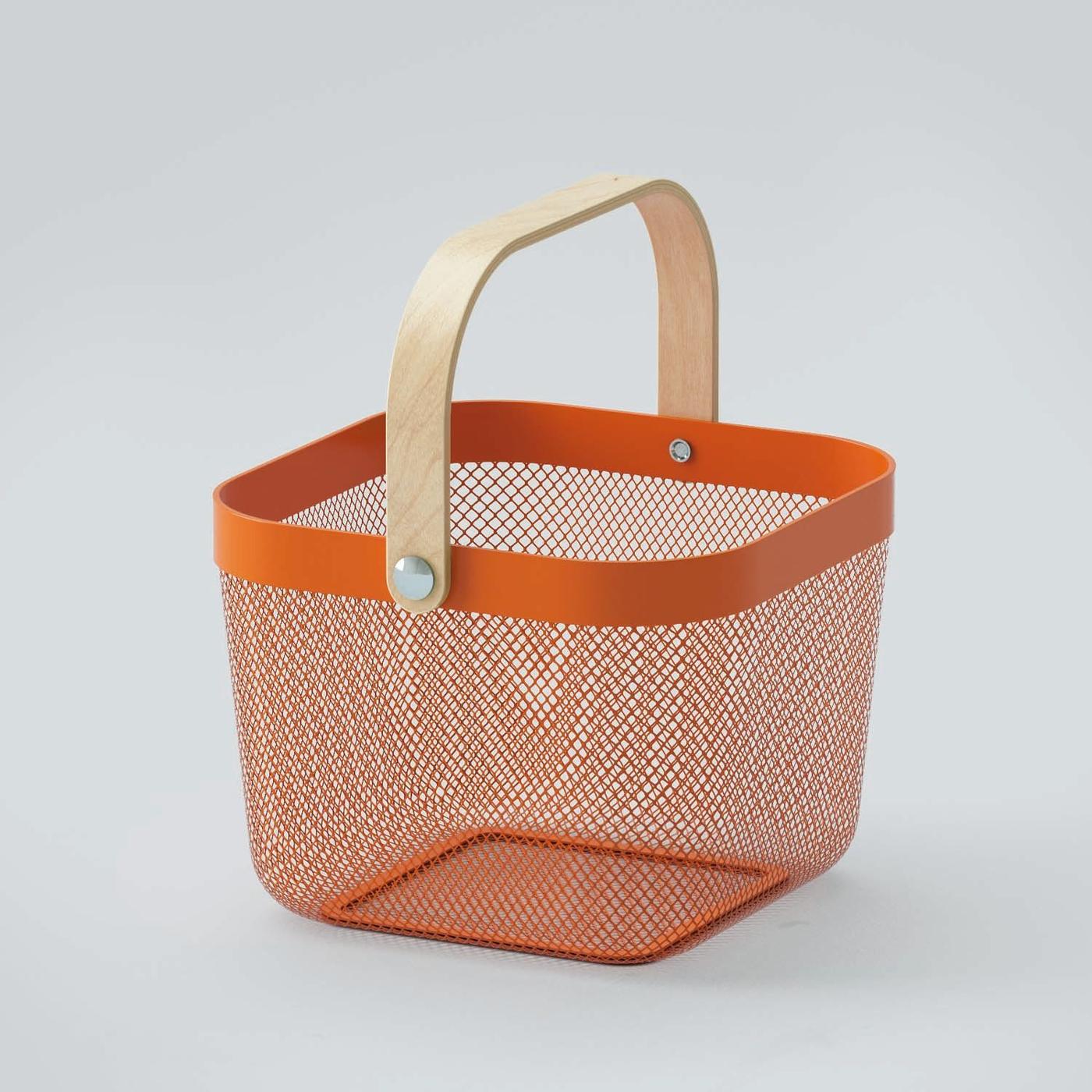 An orange metal RISATORP basket with a wooden handle.