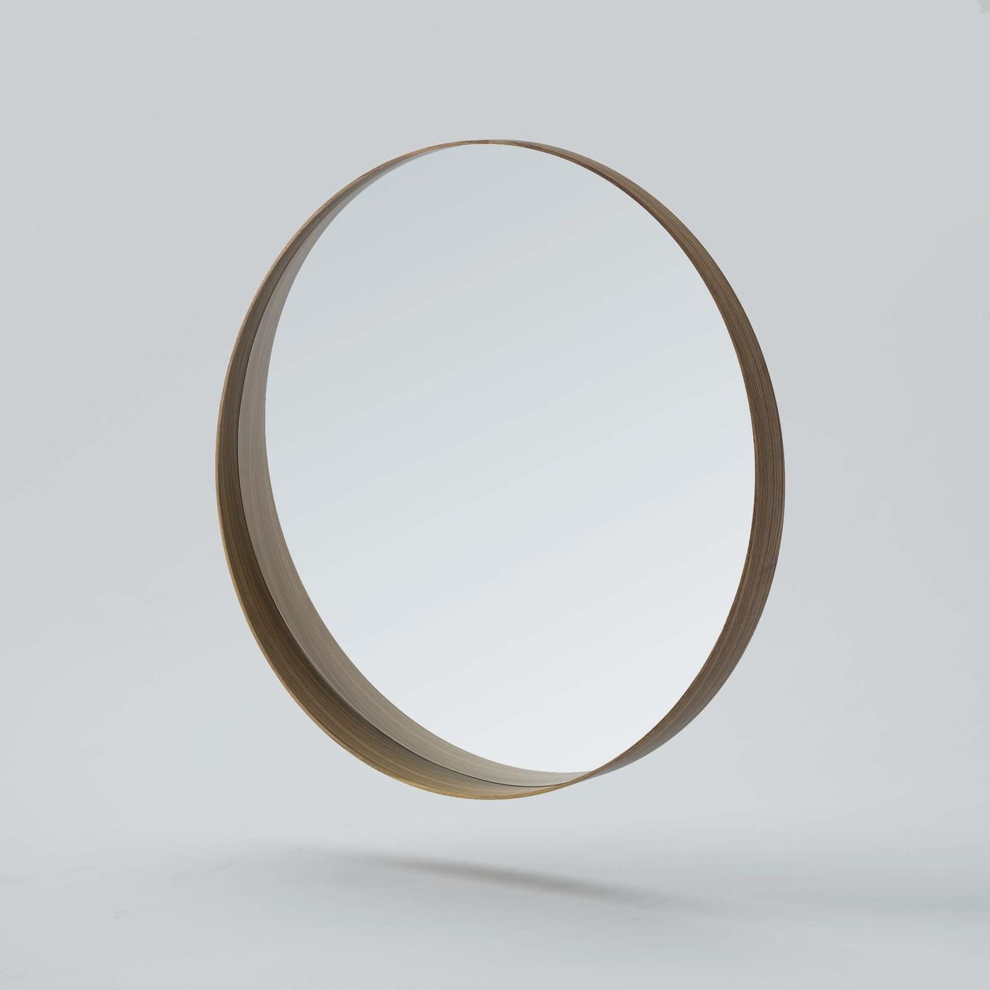 A round STOCKHOLM mirror with a wooden frame.