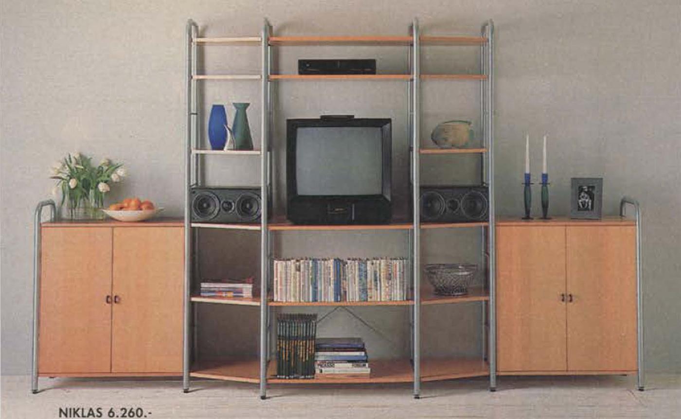 A lacquered metal and wood media unit, with cupboards at the side, open shelves and a TV in the centre.