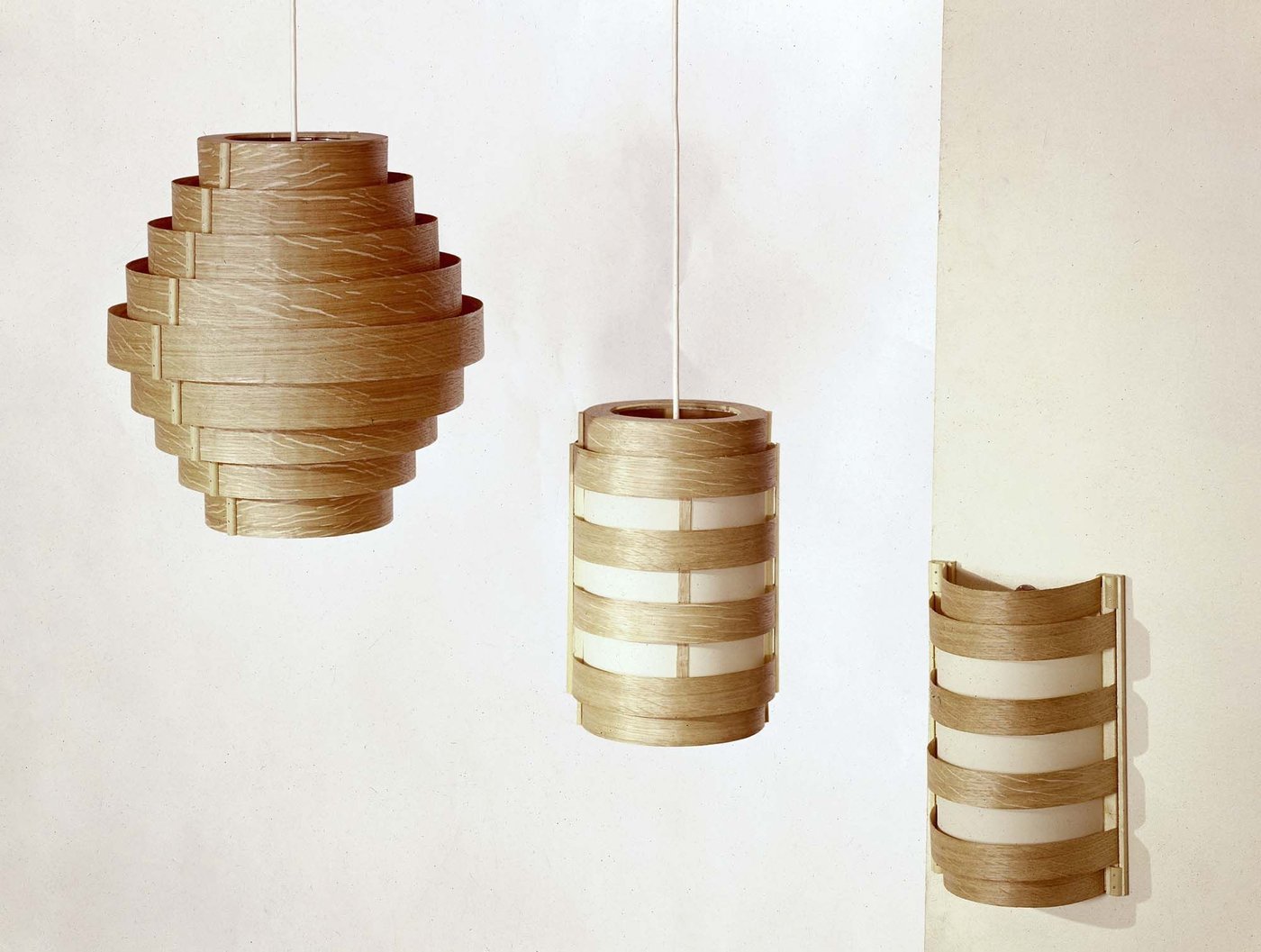 An image from the 1964 IKEA Catalogue featuring A TIVOLI lampshade and SPAN lampshades in wood.