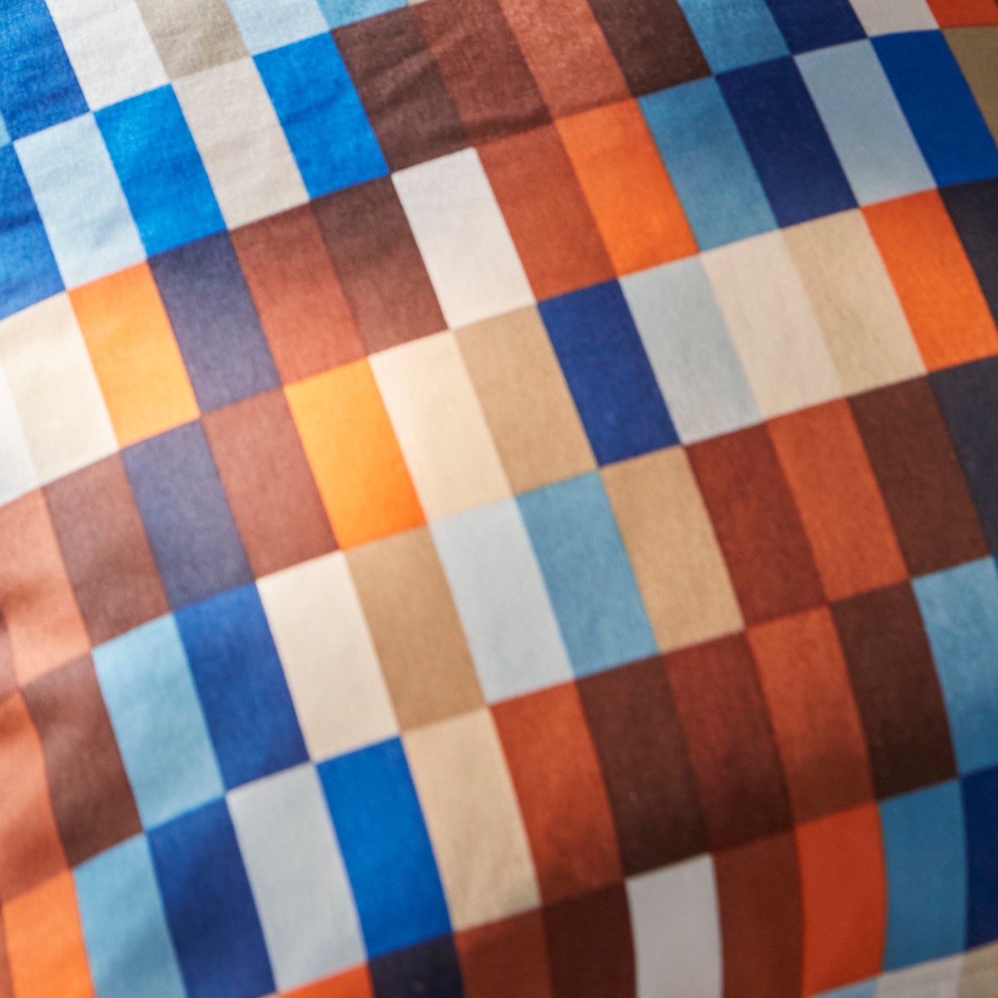 A close-up of a colourful, rectangular textile print.