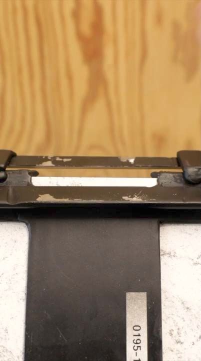 A piece of LOCKEBO worktop undergoing an edge impact test.