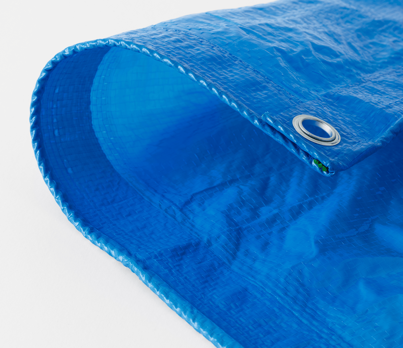 A close-up of a piece of blue tarpaulin.