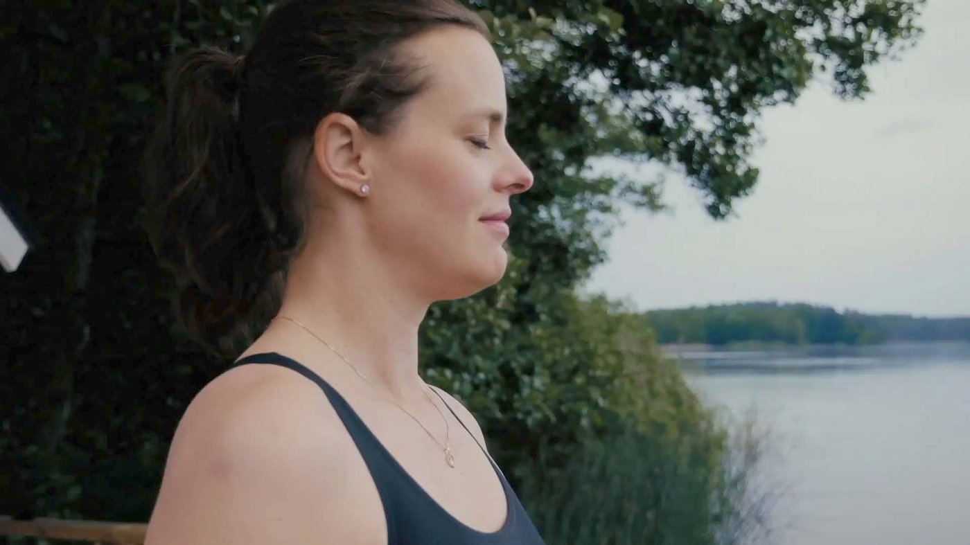 Paulina prepares to take a swim in the lake.