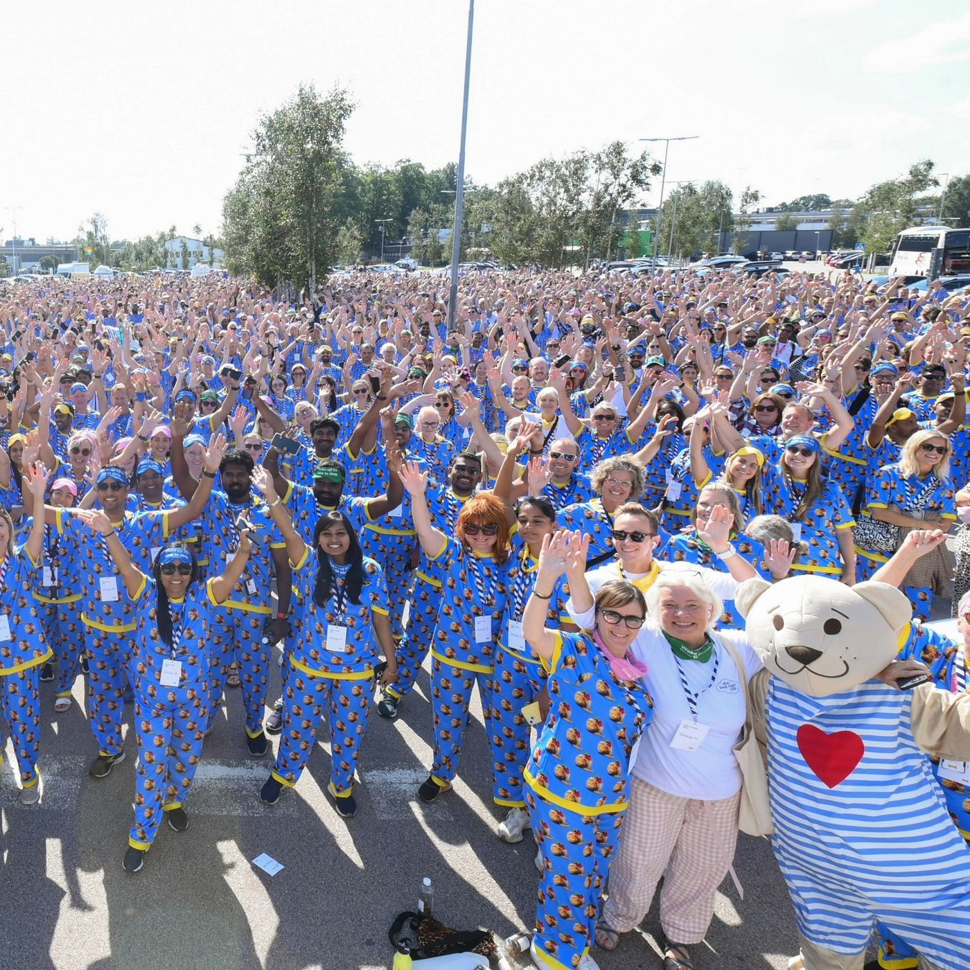 Thousands of people from IKEA cheering and wearing same pyjamas