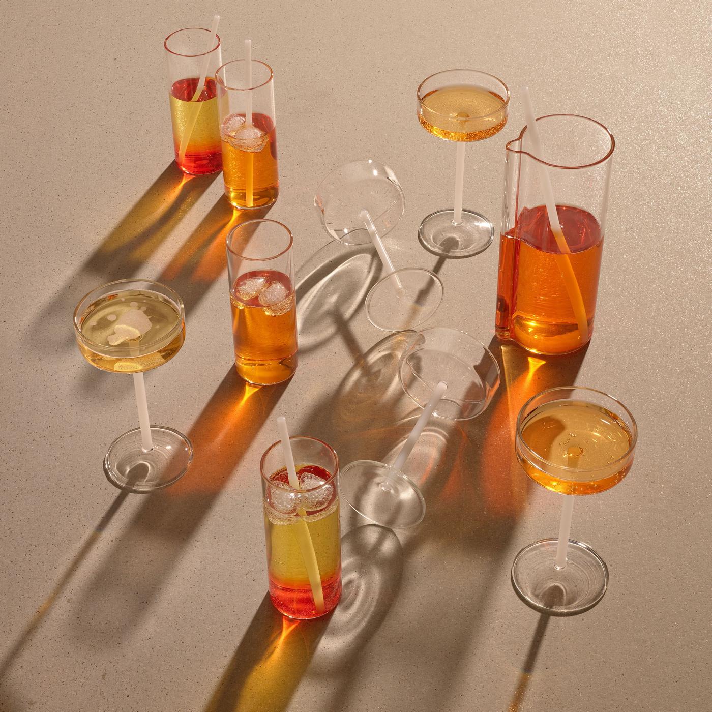 A table full of glasses and a carafe.