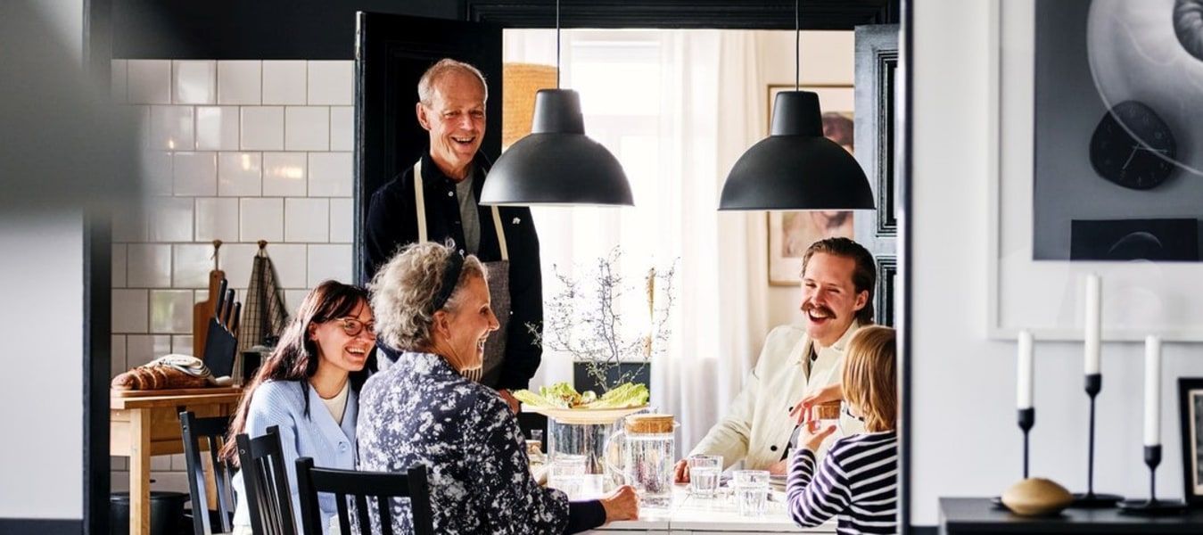 A family seated around a dining table.