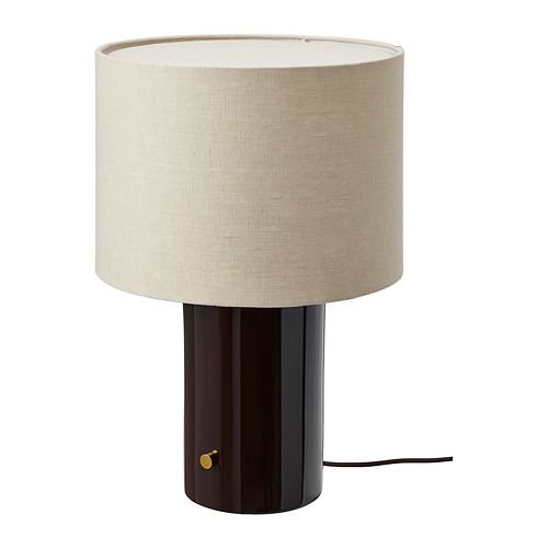  Cylindrical table lamp with a dark glazed ceramic base, beige linen shade and brass dimmer.