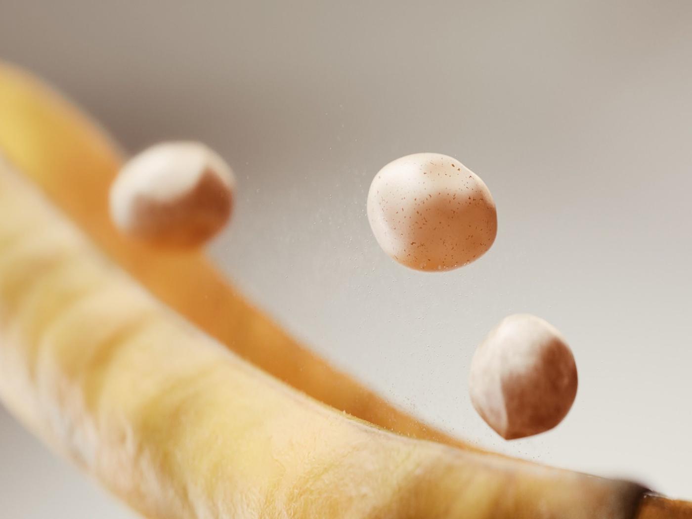 Three peas popping out of a pod.