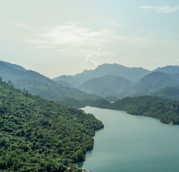 A lake surrounded by mountains and tropical rainforest in the Thua Thien Hue province in Vietnam.