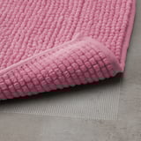 Svijetlo ružičasta, teksturirana prostirka za kupanje, mekana, brzosušeća mikrofibra.