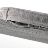 Closeup of gray recycled fabric chair cushion zipper, showcasing high-quality texture and design.