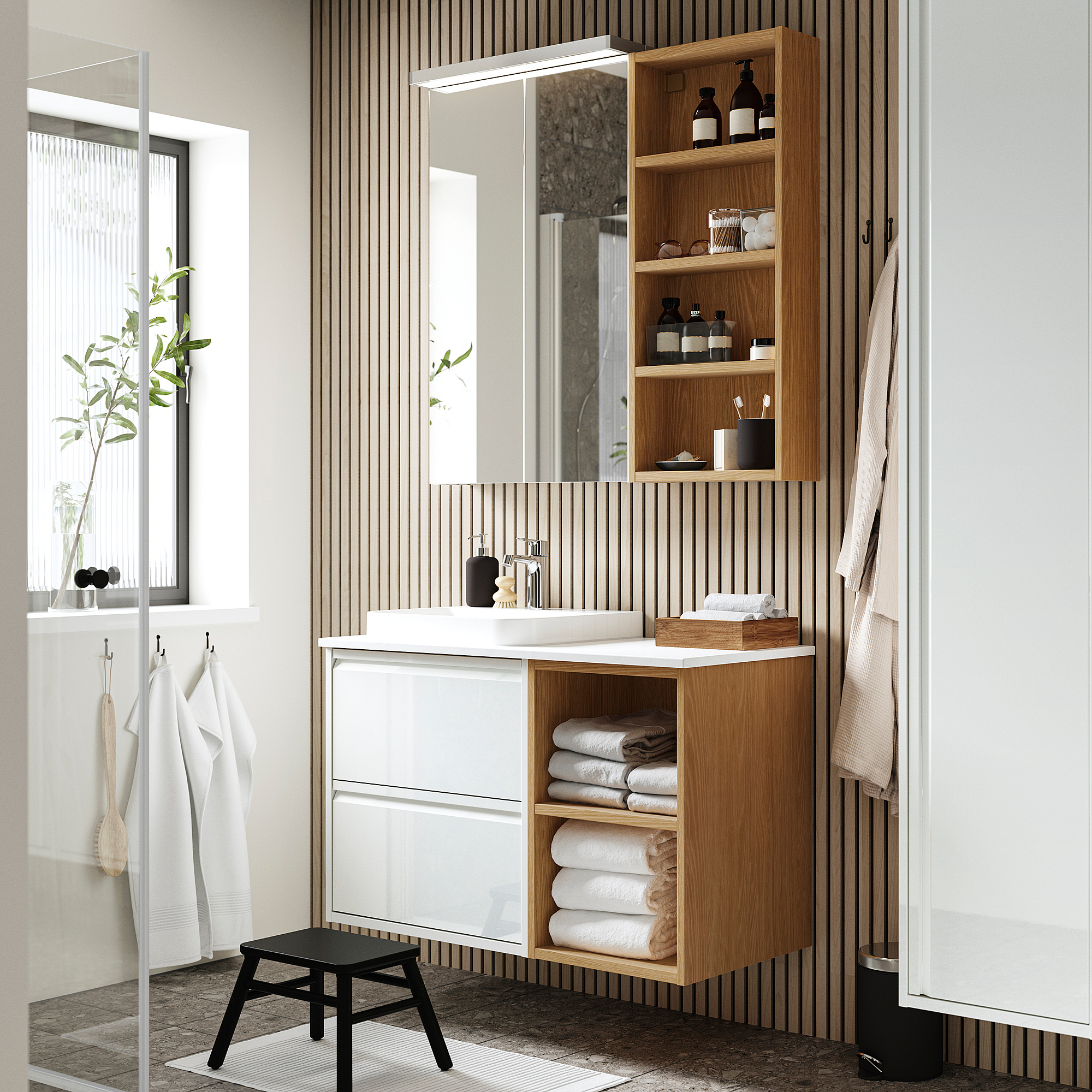 Modern bathroom with white vanity, marble counter, wooden shelves, black faucet, mirror, and hanging towels.