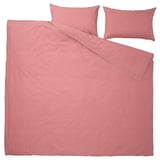 A pink ÄNGSLILJA duvet set in cotton with a simple, solid design and envelope closure pillows.