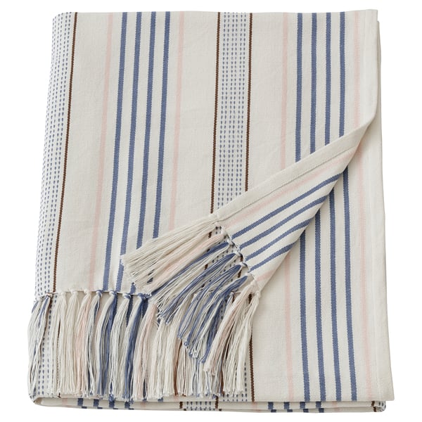 This image shows a beige and blue striped cotton throw blanket with fringe, ethically made with handwoven and knotted details.