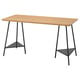 An ANFALLARE desk with a light bamboo top and black metal trestle legs, providing storage under the table.
