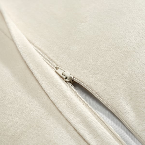 Close-up of cushion cover zipper, showing smooth, high-quality fabric and sleek zipper detail.